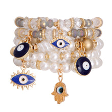 Load image into Gallery viewer, Cream Pearl Bead Evil Eye Bracelets
